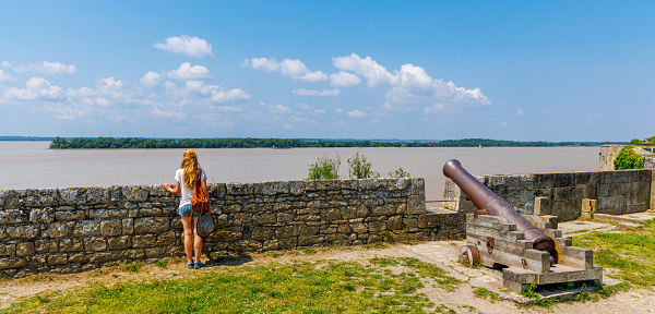 Woman looking at Garonne view in Blaye citadel- Tour tourism in France,  Nouvelle aquitaine, Gironde