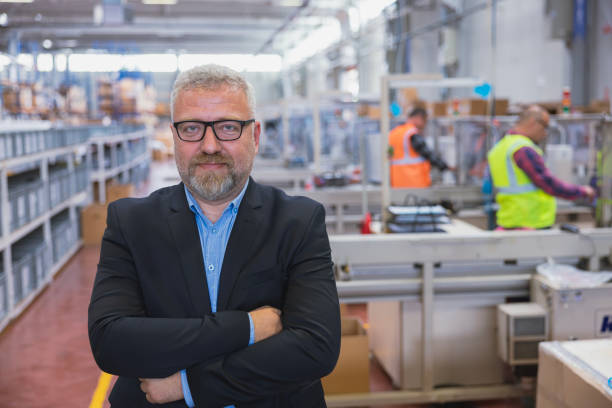 istock Serios mid adult manager in distribution warehouse 1498053206