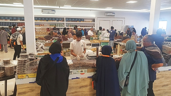 The Date Market - Medina, Saudi Arabia. May 06, 2022. The date market in Medina sells a variety of fresh dates. Not just dates, in the date market there are also food souvenirs such as chocolate, chickpeas, almonds, pischio, etc.
