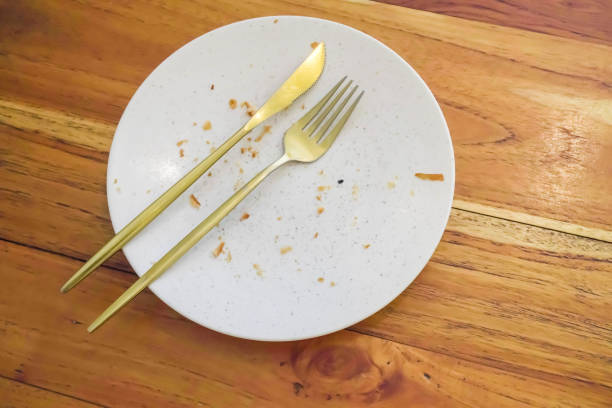 istock Empty dish white plate with traces and pieces of food 1498061621