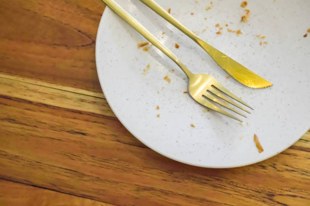 istock Empty dish white plate with traces and pieces of food 1498061624