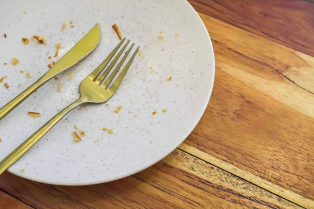 istock Empty dish white plate with traces and pieces of food 1498061637