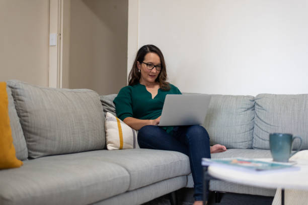 istock Mature aged woman working from home 1498062784