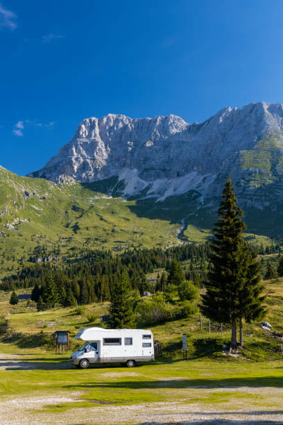 istock Caravan in summer mountain landscape, Alps, Italy 1498063325