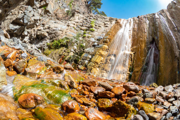 istock Orange sediment waterfall - Colorful waterfall 1498066325