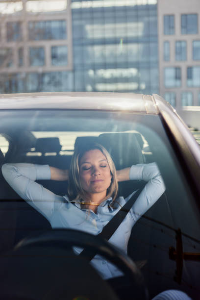 istock Smiling businesswoman resting in a car. 1498066547