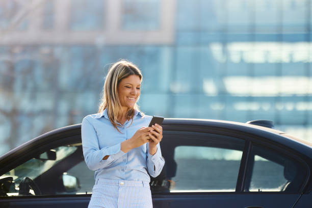 istock Happy businesswoman using cell phone on a break from her trip. 1498066564