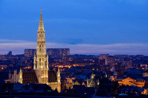 Photo of Brussels, Belgium, the tower of the city hall in the center of the city, photographed at night from a roof