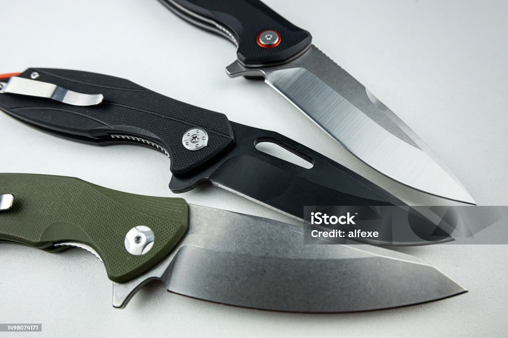 Three hunting knife or combat isolated on white Three hunting knife or combat isolated on white.  danger sharp tactical tool Knife - Weapon Stock Photo