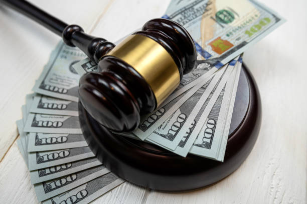 istock US 100 dollars bills with law gavel, legal issues 1498074889