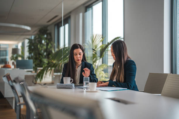 istock Handsome Asian Businesswomen Working Together 1498074984