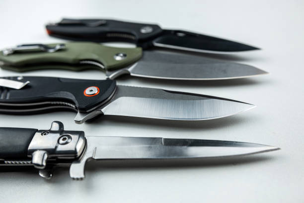 istock Four dark tactical combat knife isolated on white 1498078187