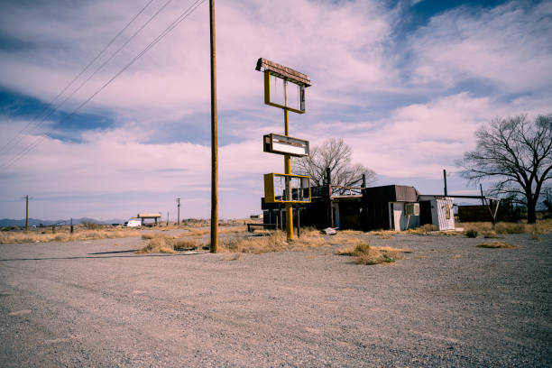 istock Abandoned business in the desert. 1498078440