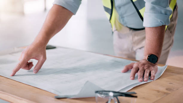 istock Blueprint, planning and construction worker or engineering manager with floor plan, insurance checklist and management. Office building, urban development and builder, contractor or architect project 1498079781
