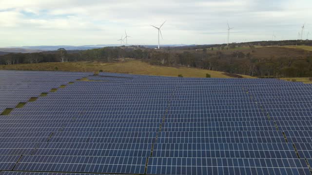 Aerial drone view of the hybrid Gullen Solar Farm and Gullen Range Wind Farm for renewable clean energy supply located at Bannister in NSW