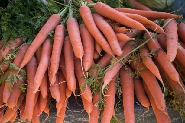 istock organic carrots stacked at the market 1498081897