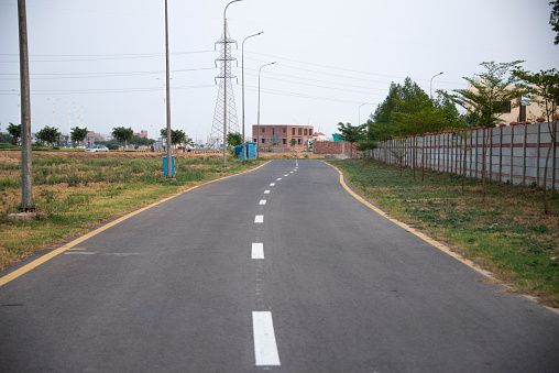 The straight rural road in Lahore city.