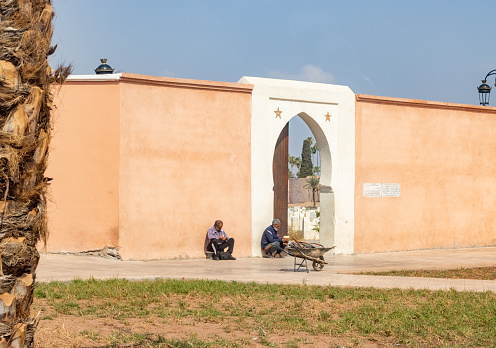 Two men outside a Cemetery near Marrakesh in Marrakesh-Safi, Morocco