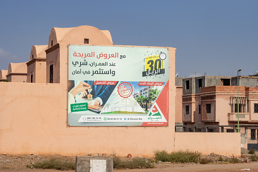 A banner poster for a Real Estate Developer in Marrakesh, Morocco, with an image visible.