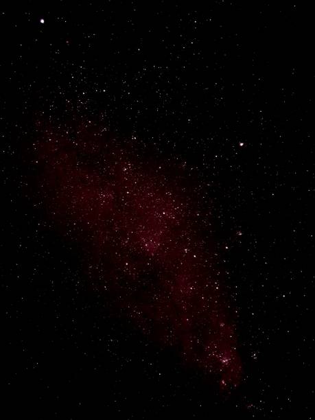 istock Cloud illuminated by the light of stars in a dark sky 1498088505