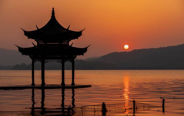 istock Gazebo near lake at sunset 1498090812