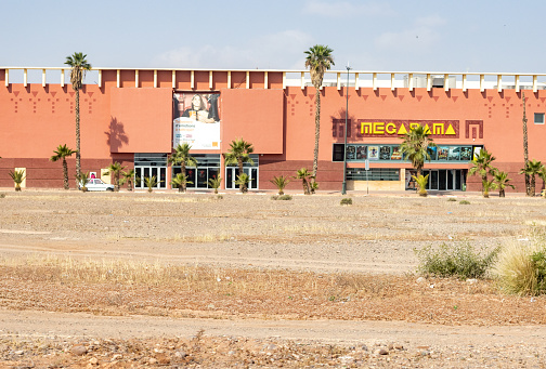 Cinéma Mégarama on Avenue du 7ème Art in Marrakesh, Morocco. This is a large cinema complex. People are visible in the distance.