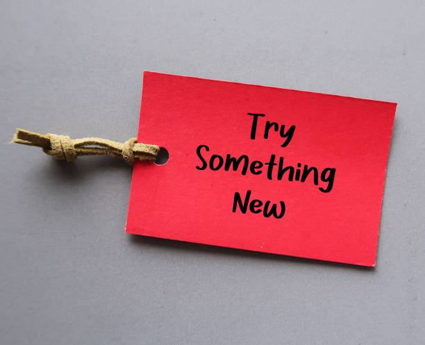 istock Red card tag on gray background with text written TRY SOMETHING NEW, to encourage midlife worker who unhappy in jobs to  find inspiration in new pathways to career success 1498095390