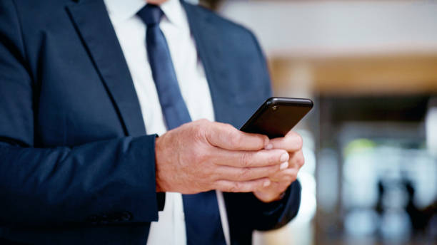 istock Smartphone, typing and businessman hands for online communication, email networking and social media with productivity. Corporate business man in suit with cellphone on mobile application negotiation 1498097456