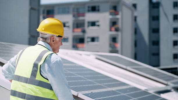 istock Solar energy, solar panel supervisor and renewable energy electricity technology for sustainability, development and innovation. Clean energy, sustainable construction worker or green tech contractor 1498099382