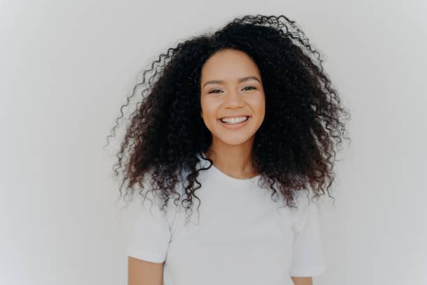 istock Smiling young woman with happy face, perfect teeth, dressed casually, isolated on white background, embracing new life. 1498099489