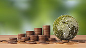 Green Globe with Network connection and  stack of silver coins. Concept of Green business, finance and sustainability investment, Carbon credit, ESG, co2 and World sustainable environment.