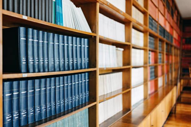 Long rows of old leather law books on a shelf for reference and study