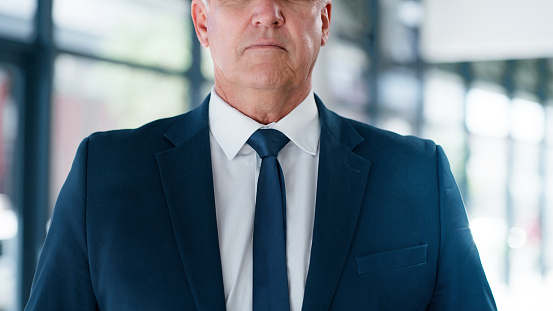 Businessman, formal suit and tie in corporate office of ceo, boss and manager for professional clothes, interview and career success. Closeup serious executive entrepreneur, leadership and politician