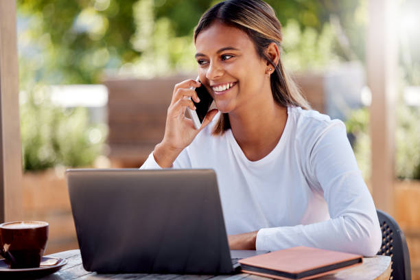 istock Study, phone call and laptop with Indian woman at cafe for remote learning, communication and online exam. Contact, technology and college with student at coffee shop for education, project or school 1498104117
