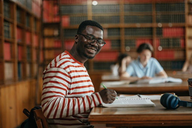 istock African american student wearing blouse with stripes in the classroom 1498105421