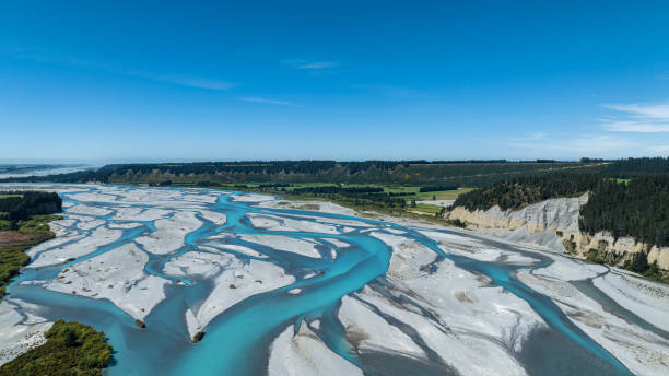 the ecosystem of the river lagoon valley -aerial view - new zealand forest landscape mountain imagens e fotografias de stock