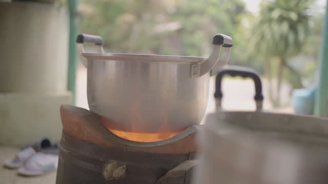Charcoal stove boiling water.