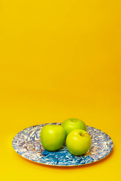 istock Green apple fruits on plate. 1498108945