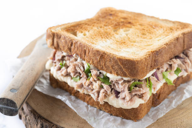 istock Tuna sandwich with mayo and vegetables isolated on white background 1498114816