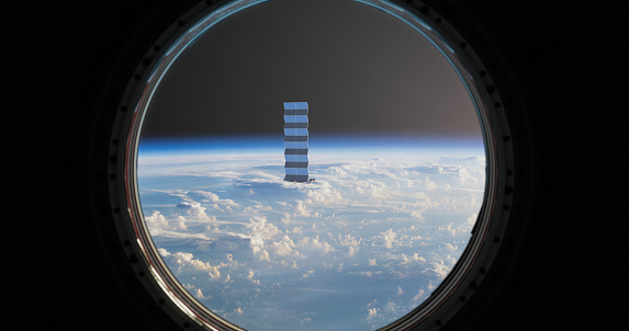 Through the spacecraft's porthole, a captivating sight awaits as a small space station comes into view. The window, meticulously designed for celestial observation, offers a glimpse of the orbiting structure against the backdrop of the vast cosmos.