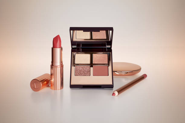 istock Makeup palette, lipstick and lip pencil  on a colorful background 1498115472