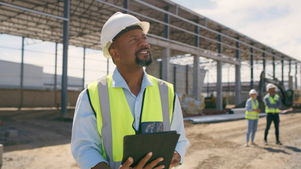 istock Man, construction and tablet at site for project management, building logistics or app. Male person and engineering worker on digital technology at industrial architecture design 1498116363