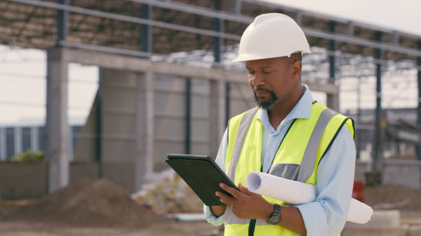 istock Man, construction and tablet at site for project management, building logistics or app. Male person and engineering worker on digital technology at industrial architecture design 1498116388