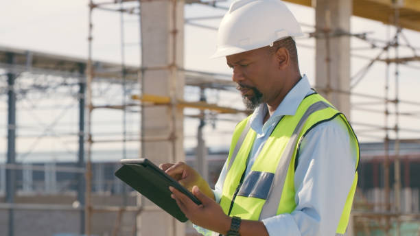 istock Man, construction and tablet at site for project management, building logistics or app. Male person and engineering worker on digital technology at industrial architecture design 1498116673
