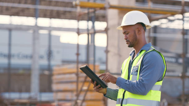 istock Man, construction and tablet at site for project management, building logistics or app. Male person and engineering worker on digital technology at industrial architecture design 1498116746