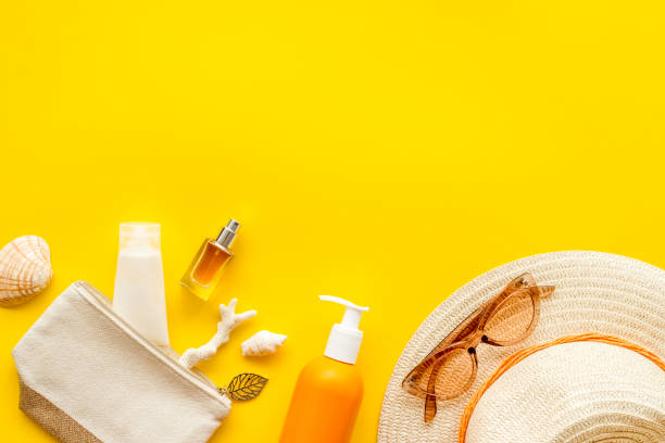 istock Beach accessoties with sunscreen cosmetic and straw hat. Summer beach concept flatlay 1498117079