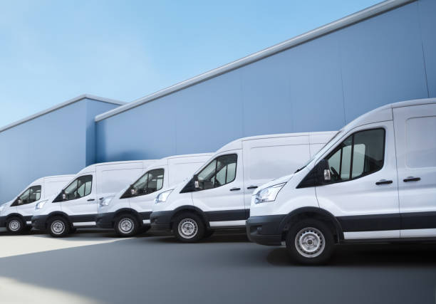 istock White vans in front of the distribution warehouse 1498117192