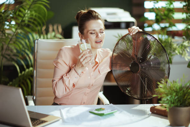 istock smiling modern female employee in modern green office 1498117345