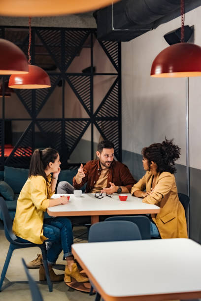 istock Business team chatting about something during the coffee break at the workplace. 1498120343
