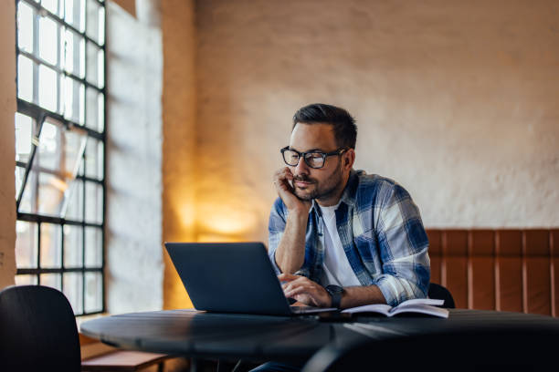 istock Thoughtful businessman working over the laptop, searching someth 1498120687